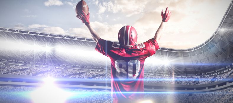 American football player in helmet holding rugby ball with arms in the air against composite image of arena sport against cloudy sky