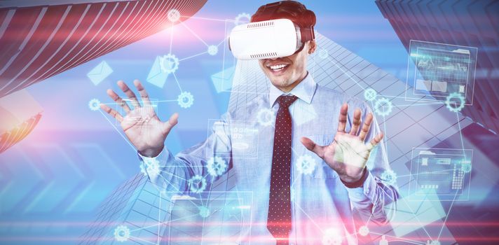 Happy businessman using vr glasses against composite image of data analysis interface background 