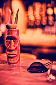 Close up of bar accessories with moai mug in bar