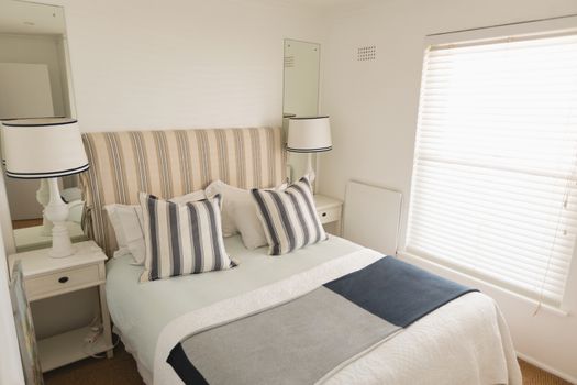 Modern luxury bedroom with double bed blankets and pillows at home