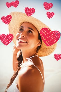 Red Hearts against happy woman posing on the beach