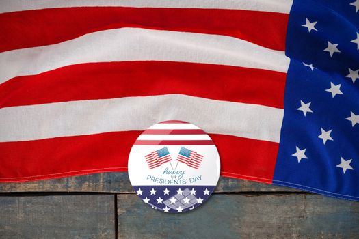 happy presidents day vector typography and two american flags against american flag on a wooden table