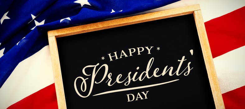 Happy presidents day. Vector typography against blank slate on national flag