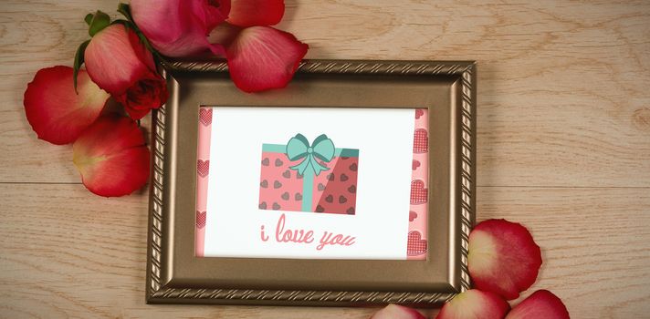 Cute Valentines Day message in Frame on desk with gifts and petals