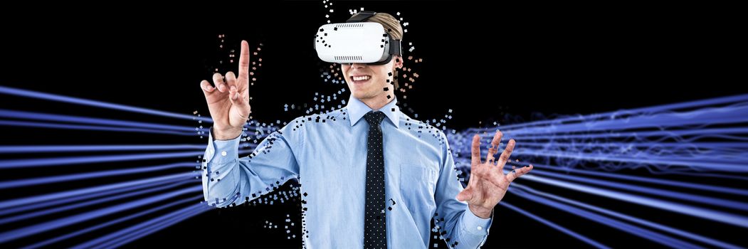 Happy young businessman gesturing while wearing futuristic glasses against futuristic glowing lines on black background