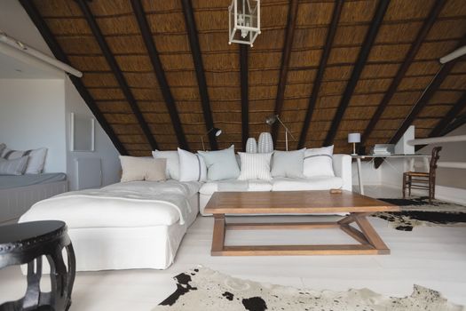 Empty stylishly decorated luxurious living room in modern house 
