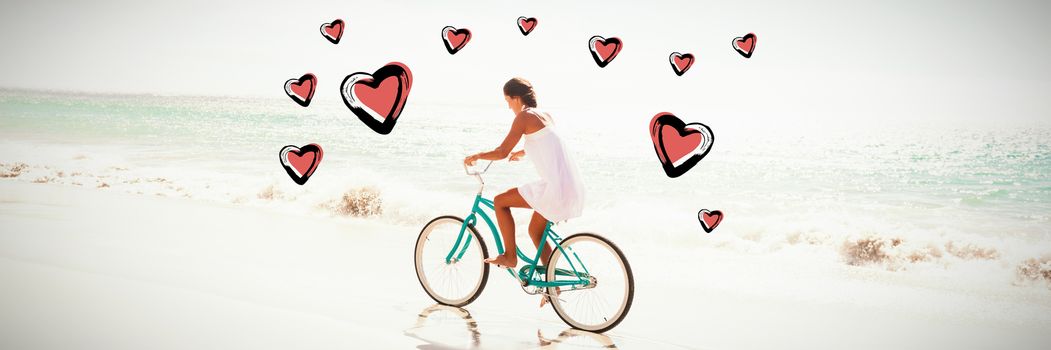 Red Hearts against  carefree woman going on a bike ride Carefree woman going on a bike ride on the beach