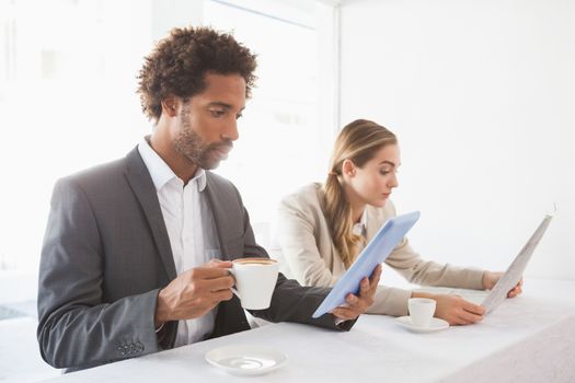 Business people having coffee on their break at the coffee shop