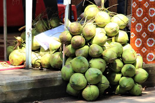 Coconuts in a big pile ready to sell