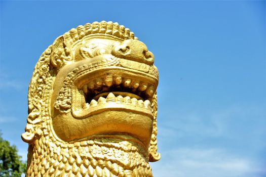 Golden lion head outside royal gardens in cambodia