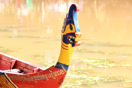 Water festival boat cambodia river racing. a brightly coloured prow of the racing boats in siem reap