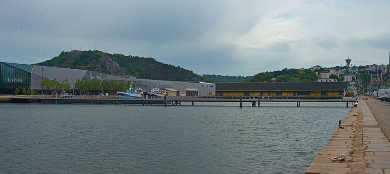 CHERBOURG, FRANCE - June 6th 2019 - Pier with dock and modern building at shore