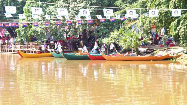 Boats on river in siem reap ready for the water festival boat race