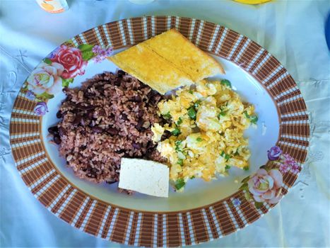 Nicaraguan breakfast. Rice, beans, eggs, bread, cheese