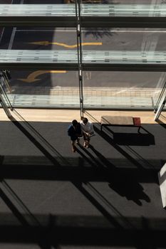 High angle view of young multi-ethnic business executive working together standing in modern office