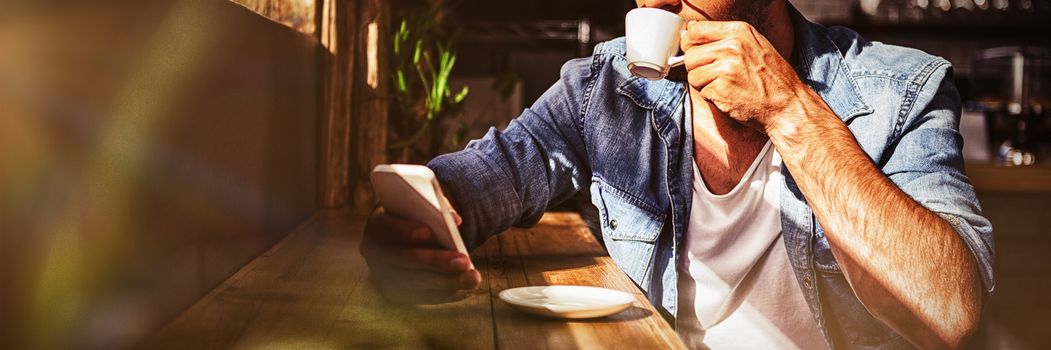 Man drinking a cup of coffee in the cafe