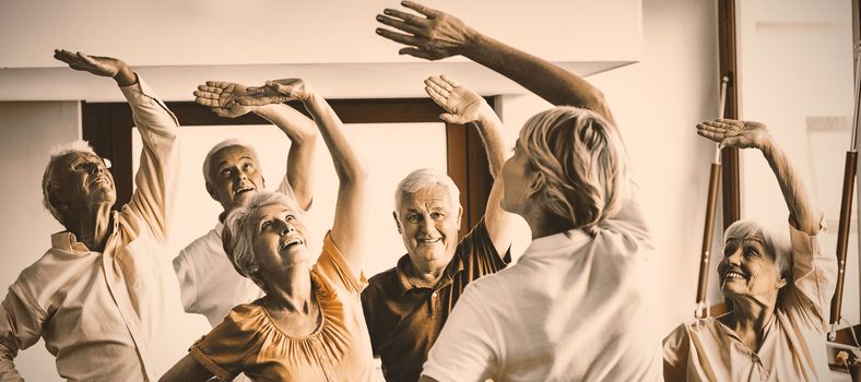 Seniors doing exercises in a retirement home