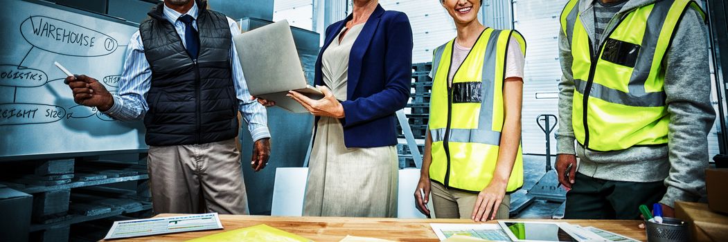 Team portrait of workers in warehouse