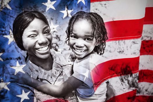 Close-up of an American flag against happy family posing together