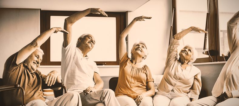 Seniors doing exercises in a retirement home