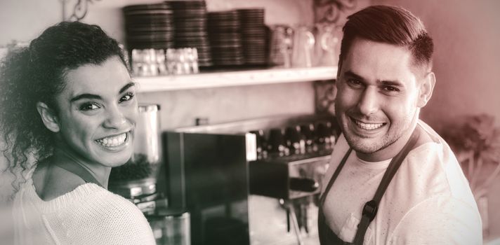 Portrait of smiling waitress and waiter in cafe