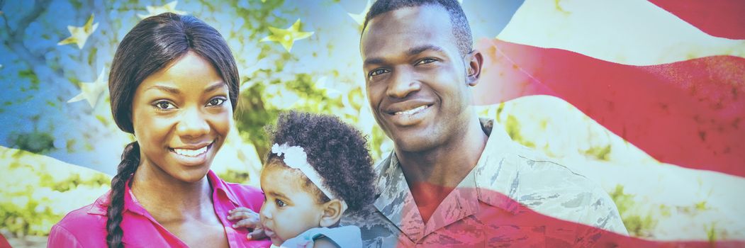 American flag with stars and stripes against portrait of happy family posing together