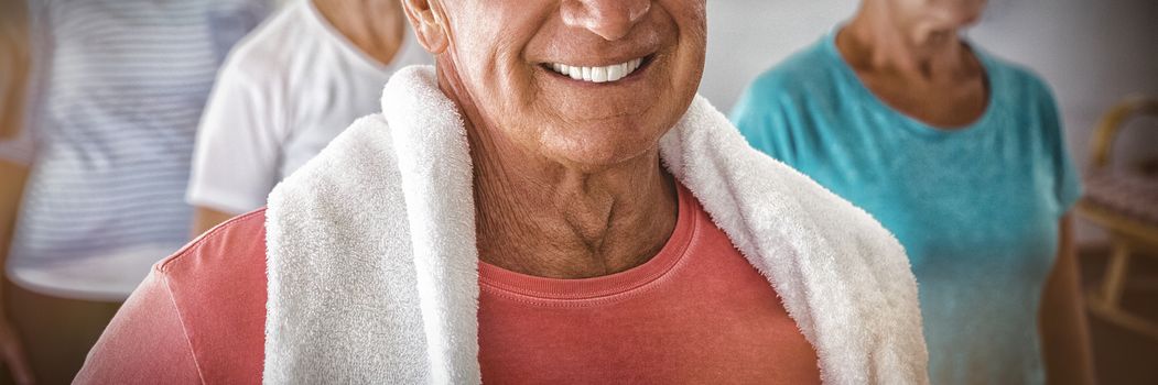 Portrait of senior smiling after exercises in retirement house