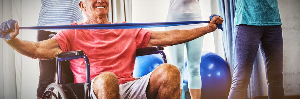 Seniors stretching during fitness class in retirement house