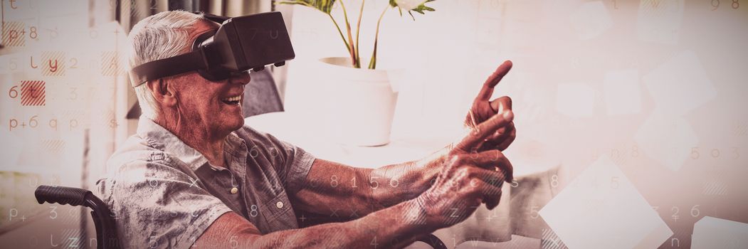 Senior man in a wheelchair using a virtual reality device in a retirement home