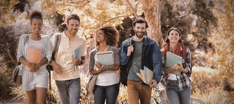 Group of college friends walking in campus