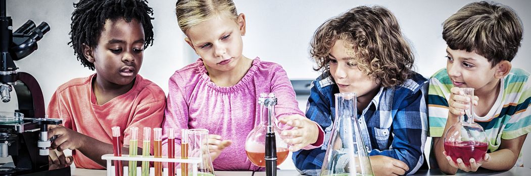 Kids doing a chemical experiment in laboratory at school