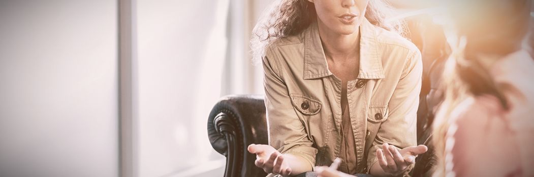  Psychologist having session with her patient in office