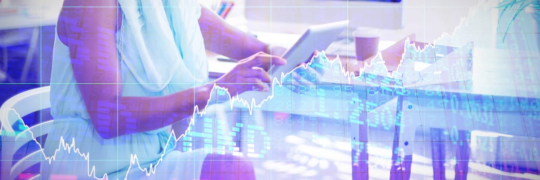 Stocks and shares against business executive using digital tablet