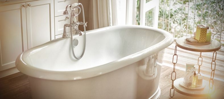 View of empty bathtub in bathroom at home