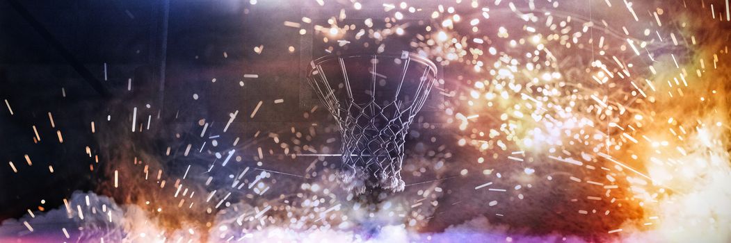 Basketball hoop hanging against a dark background