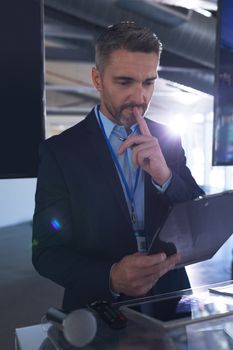 Front view of caucasian Male speaker practicing his speech in business seminar at conference meeting. International diverse corporate business partnership concept