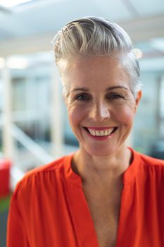 Portrait of Caucasian female graphic designers smiling in office. This is a casual creative start-up business office for a diverse team