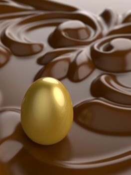 An Easter golden egg with chocolate ornament in front.