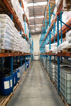 Barrel and goods arranged on a rack in warehouse. This is a freight transportation and distribution warehouse. Industrial and industrial workers concept