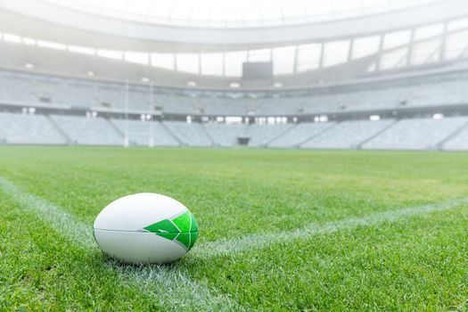Close-up of Rugby ball on a grass in the empty stadium