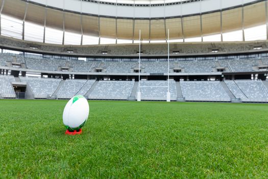 Front view rugby ball on a stand in a empty stadium