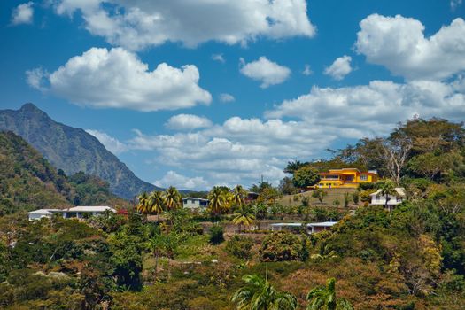 Colorful homes clinging to hills on a tropical island