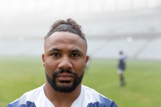 Portrait of  African american rugby player looking at camera in the stadium
