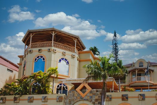 A colorful shopping mall of stucco and mosaic tile in the tropics