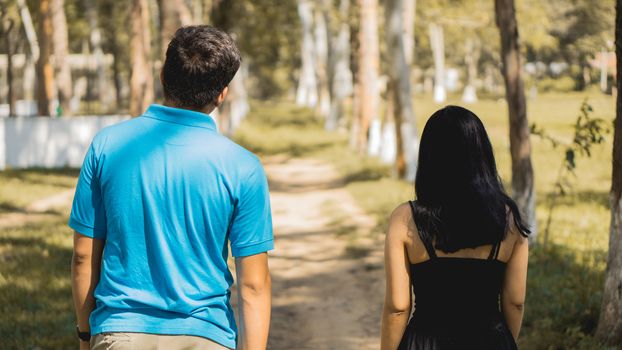 Couple walking in the park on autumn