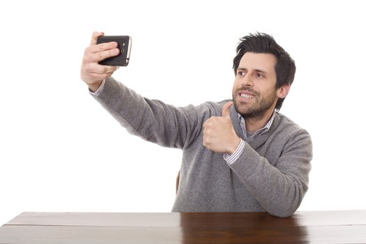 man taking selfie photo with mobile phone camera posing happy and successful isolated on white background