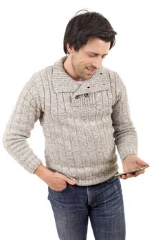 young casual man looking to his phone, isolated
