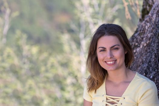 Portrait of a happy young woman, outdoor.