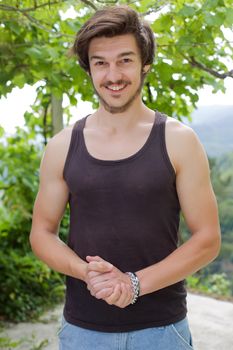 portrait of happy handsome young man, summer outdoors.