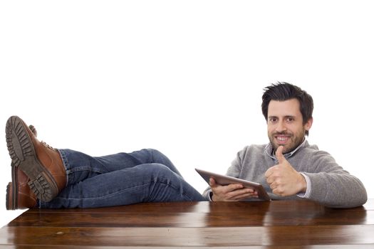 happy man working on a desk with a tablet pc, isolated